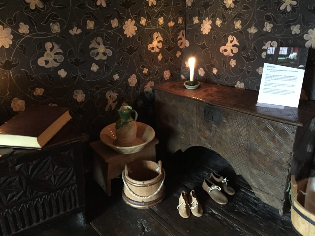 Underneath the little table Shakespeares house is a section of the original wood floor from the late 1500s when William lived here.