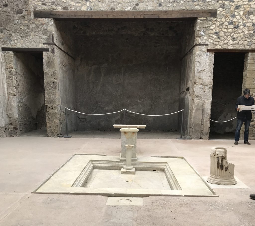 A recently opened house has a marble courtyard. Like other houses, it too has the water collection holes and wells to pull out water.