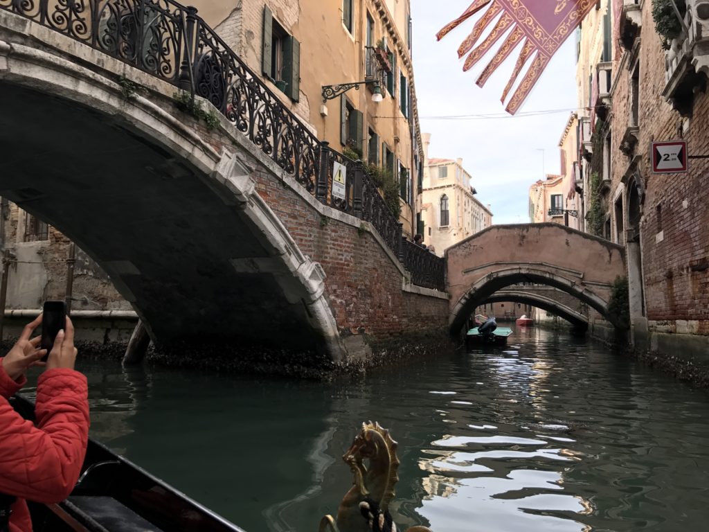 The view of a multi canal intersection from a gondola in Venice