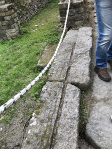 Grooves in the stone - are marks left from wooden doors that once stood at the entrance of stores in Pompeii.