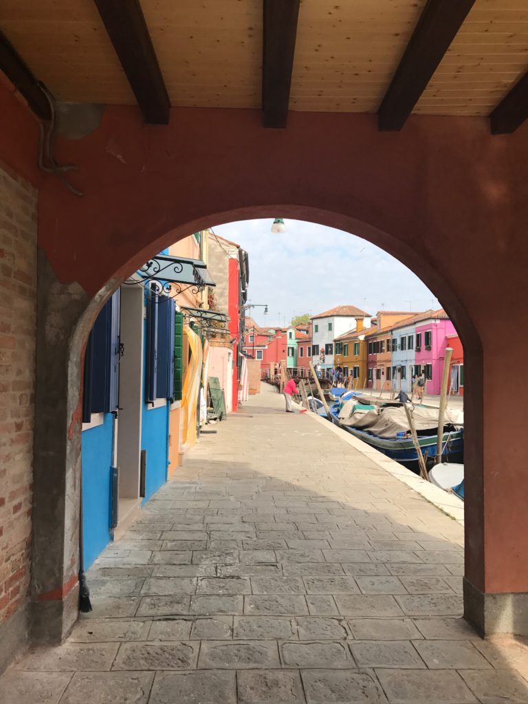 Walking along the waterfront in Burano. 