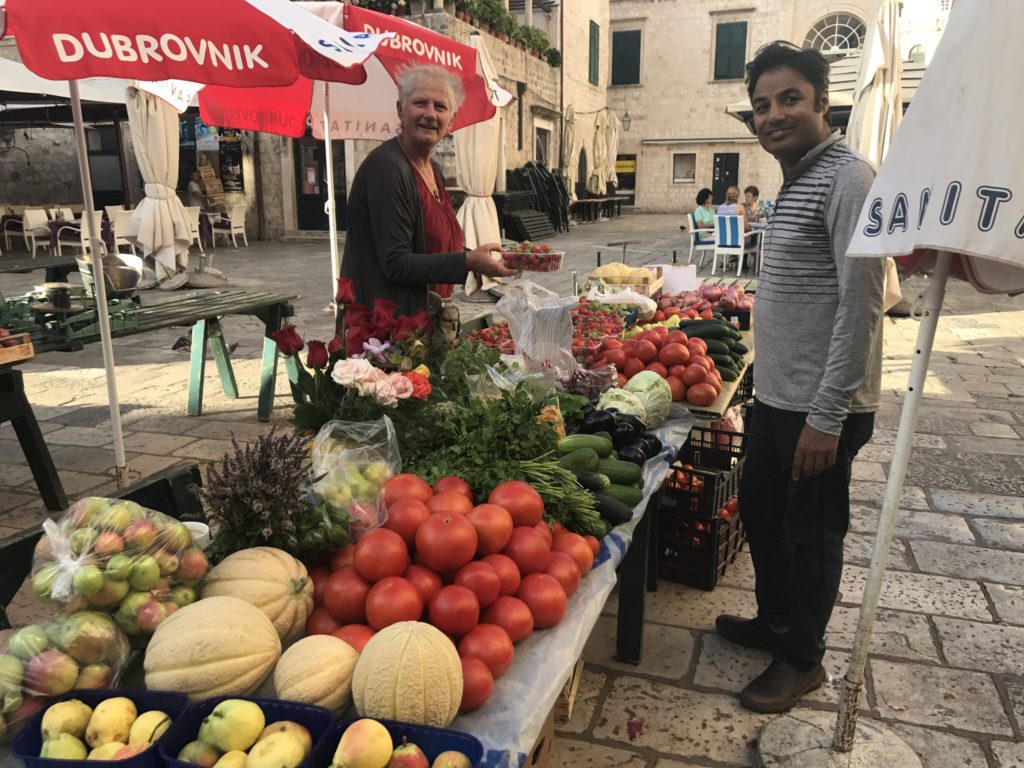 Picking out fruit and tomatoes for breakfast in our apartment. 