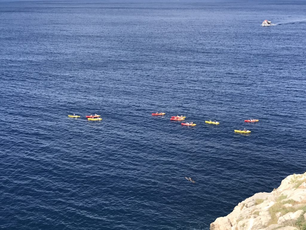 The colorful kayaks look so pretty in the deep blue water as we look down from the cafe on the Dubrovnik wall. 