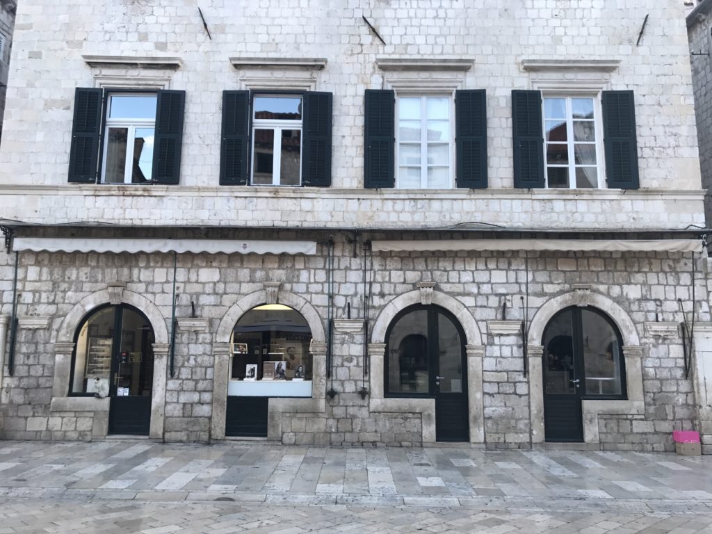 Most of the buildings on Dubrovnik's main road look the same, for centuries. Notice the entrances. 