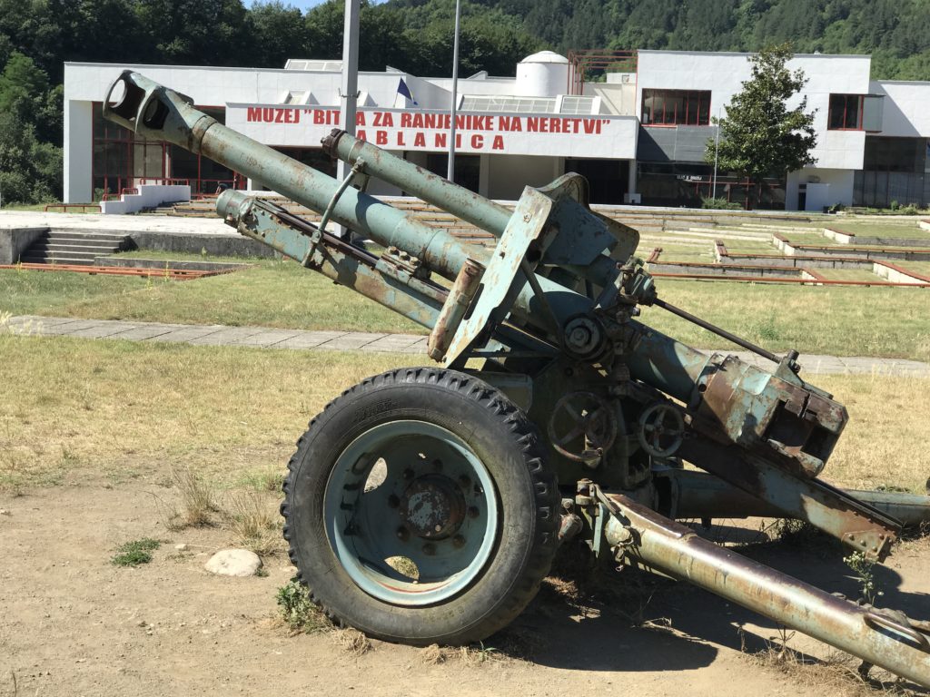 Near the destroyed bridge is a small historic museum, seating for events and weapons from the World War II days. 