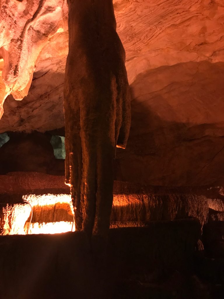 The hand shaped sculpture hanging from the Radachi cave ceiling. 