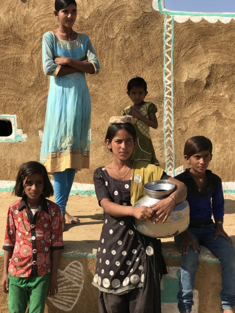 All the kids we hung out with were friendly and just pure joy to be with. The girl in the black shalwar kameez stopped to chat with me, as she was heading out to fetch water for her home. As is customary in most rural India, she is no longer in school and probably getting ready for marriage. 