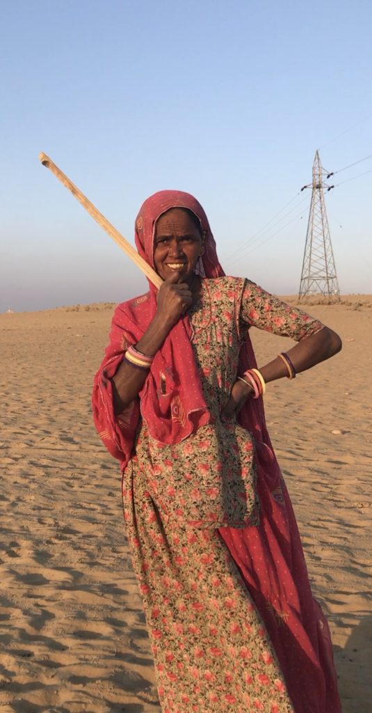 She is now heading home after tucking her cows to bed in the dunes. She herded the cows from all around up the dunes. She says they’ll stay there all night and not get lost in the desert. 