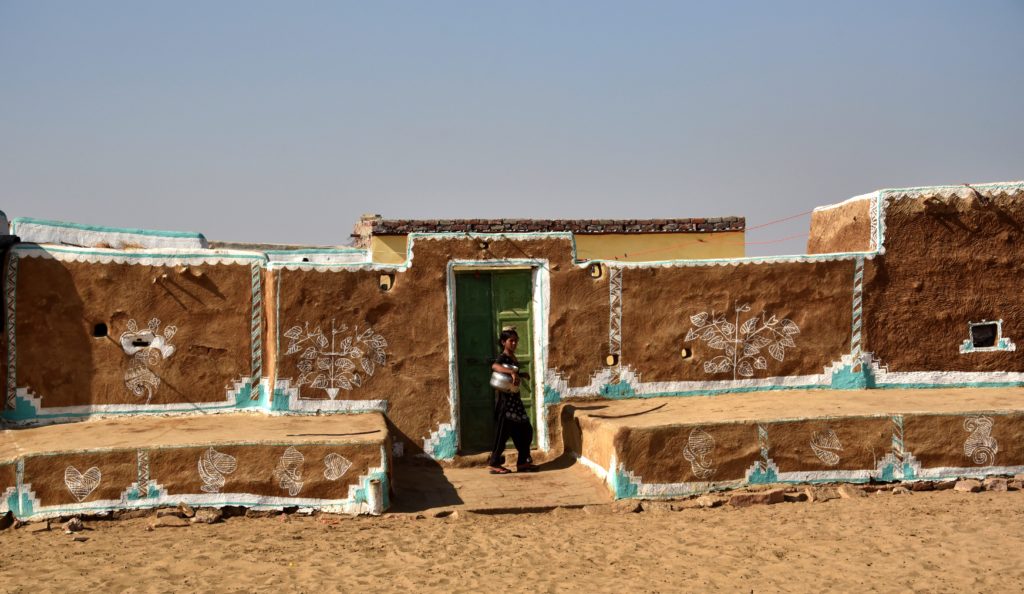 The house is owned by young Jaipal Singh’s family. They cover the mud house with cow dung and paint designs with white and green colors from Ramgadh, the closest big town. 