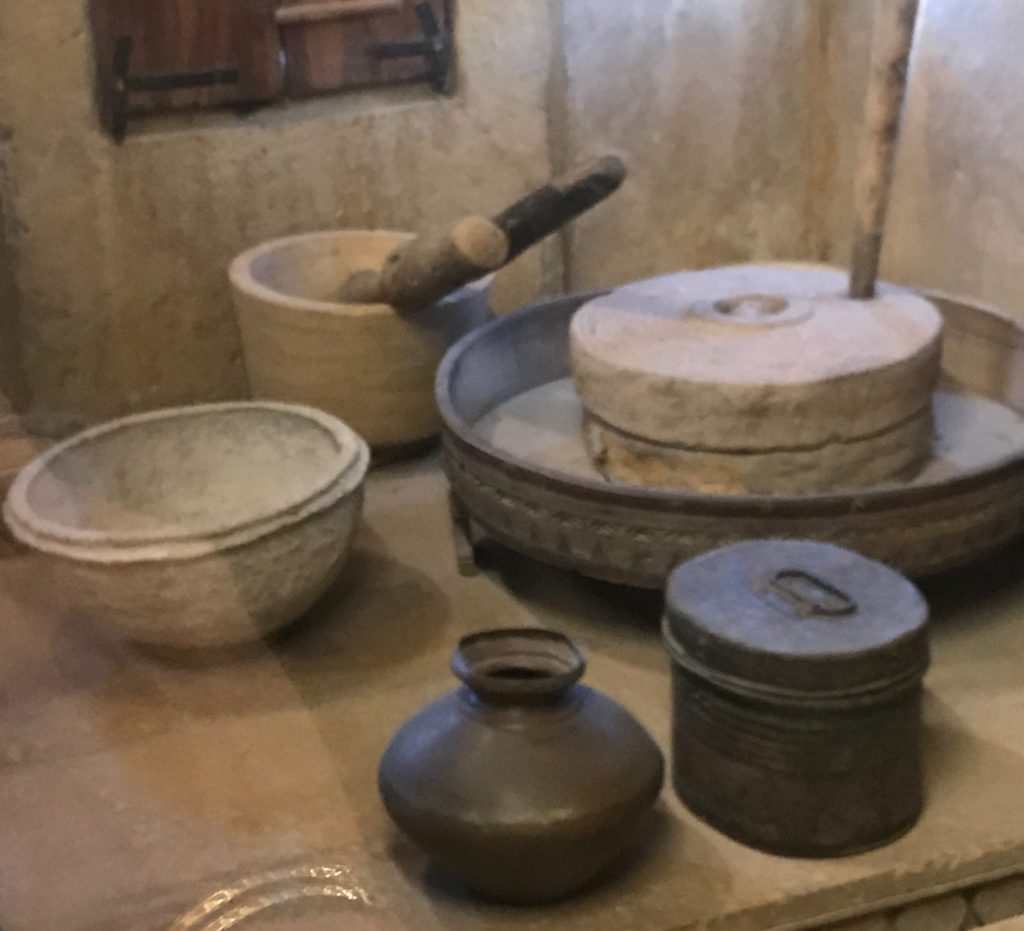 The kitchen had many gadgets, some common in Rajasthani kitchens and others only found in wealthy merchant homes. To the right is a grain grinder for making flour. It was very common in Rajasthan to make fresh flour each day. My grandfather used it as a great workout, every morning. 