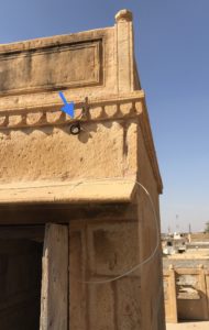 A metal hook on one of the entrance structures to hold the roof coverings. The hinges are in several places to provide different options for the tent setup. 