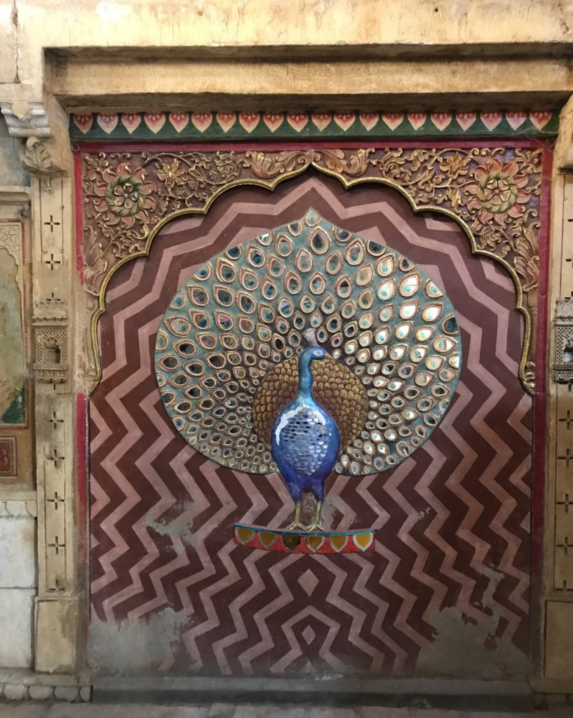 The formal living room shows beautiful peacock design to welcome visitors. 