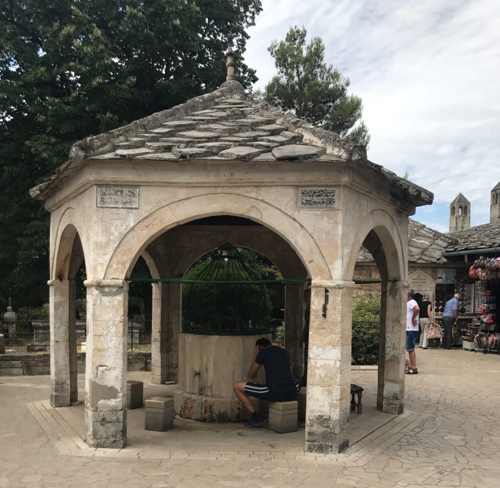 Across from the mosque is a water fountain that also serves as a place to wash and rest. 