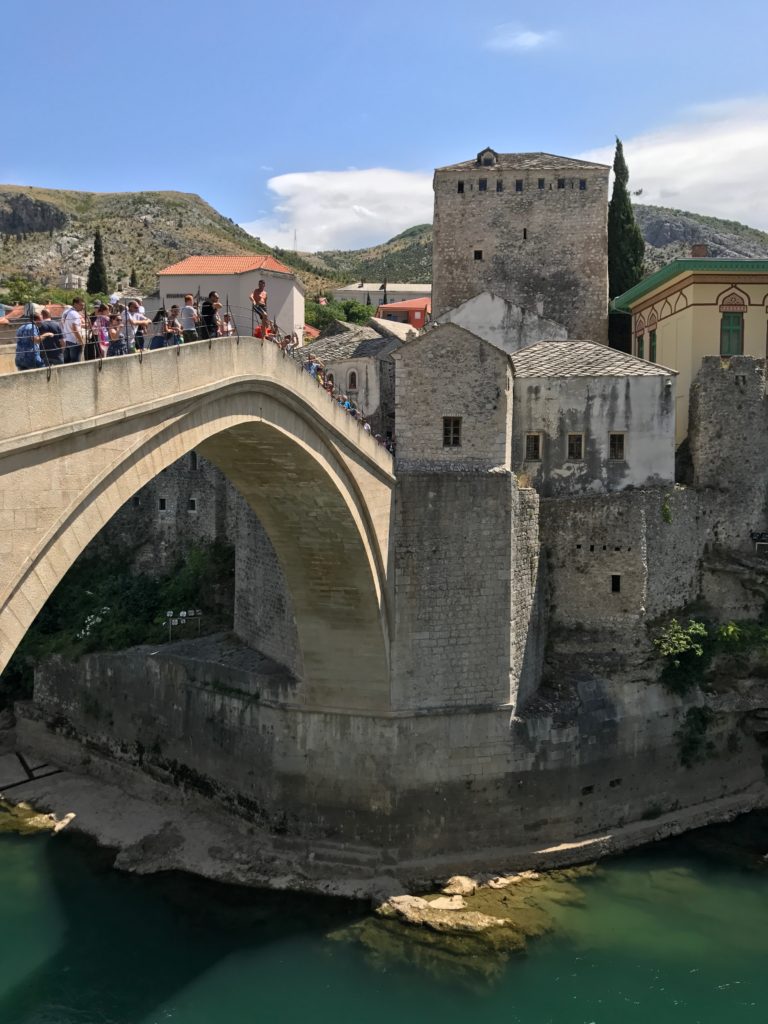 Mostar bridge jump - A man getting ready to jump off the Mosta Stari Most.