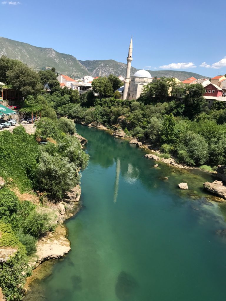 Looking around from the Top of the Stari Most (old bridge) we're treated with amazing views. Later we'll climb this mosque tower for the grand view of Mostar Old Town.