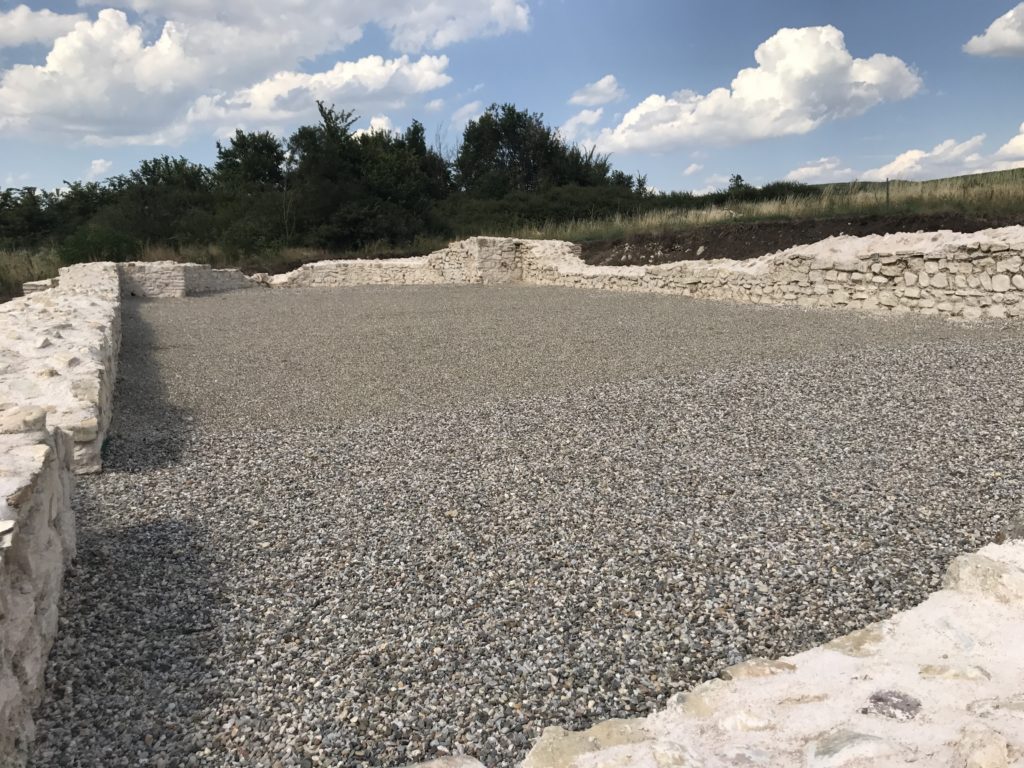 Dresnik Mosaic in Kosovo is kept covered by a plastic sheet and pebbles to prevent damage.