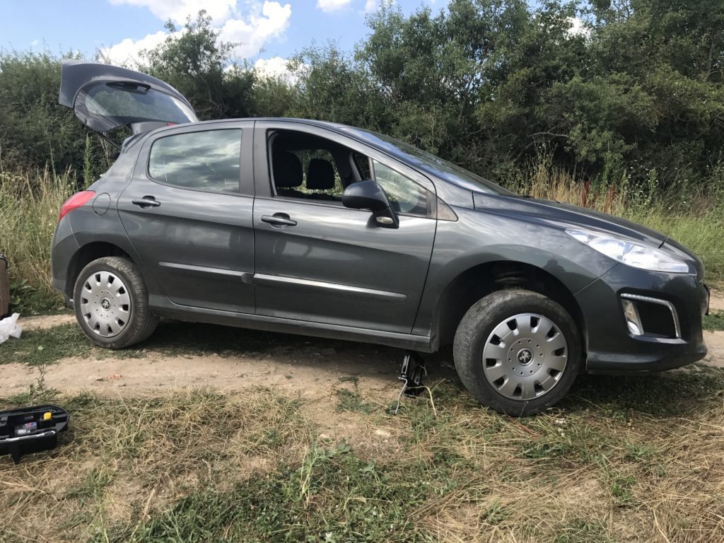 Temporary fix to our rental car at the Roman excavation site in Kosovo