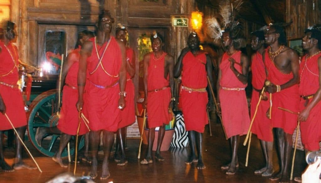 Masai Dancers jump up and down to drum music.