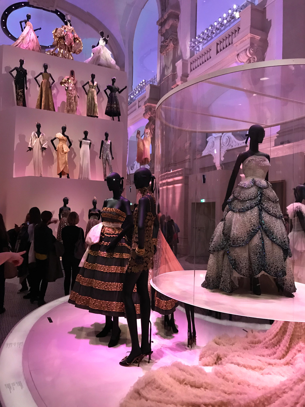 The final and main hall exhibiting Christian Dior dresses in the ultimate display of French fashion.