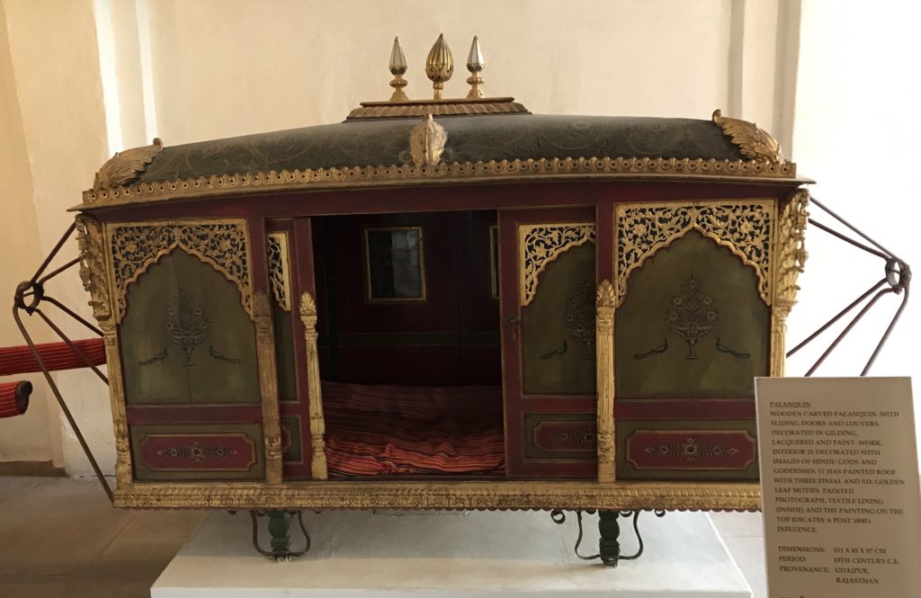 This is a queen’s palaquin but palaquin were used by women as recently as early 20th century to travel in pardha (covered from view)