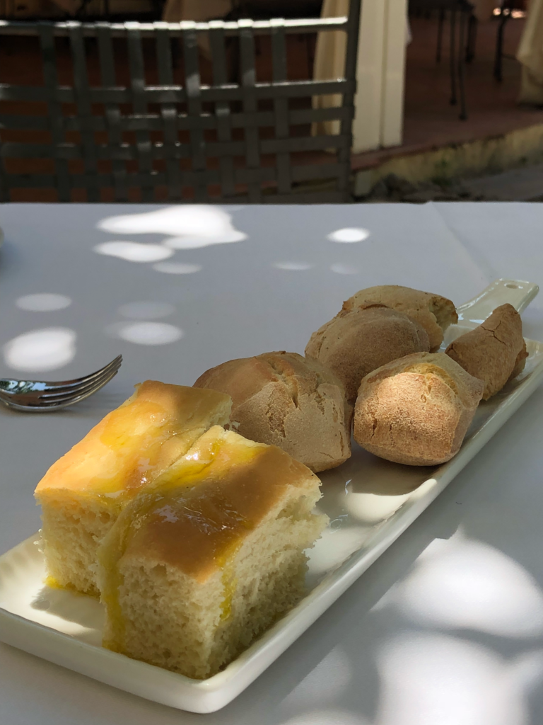 Sicilian focaccia, white bread and local nutty nero flour bread served with a delicious Sicilian olive oil.