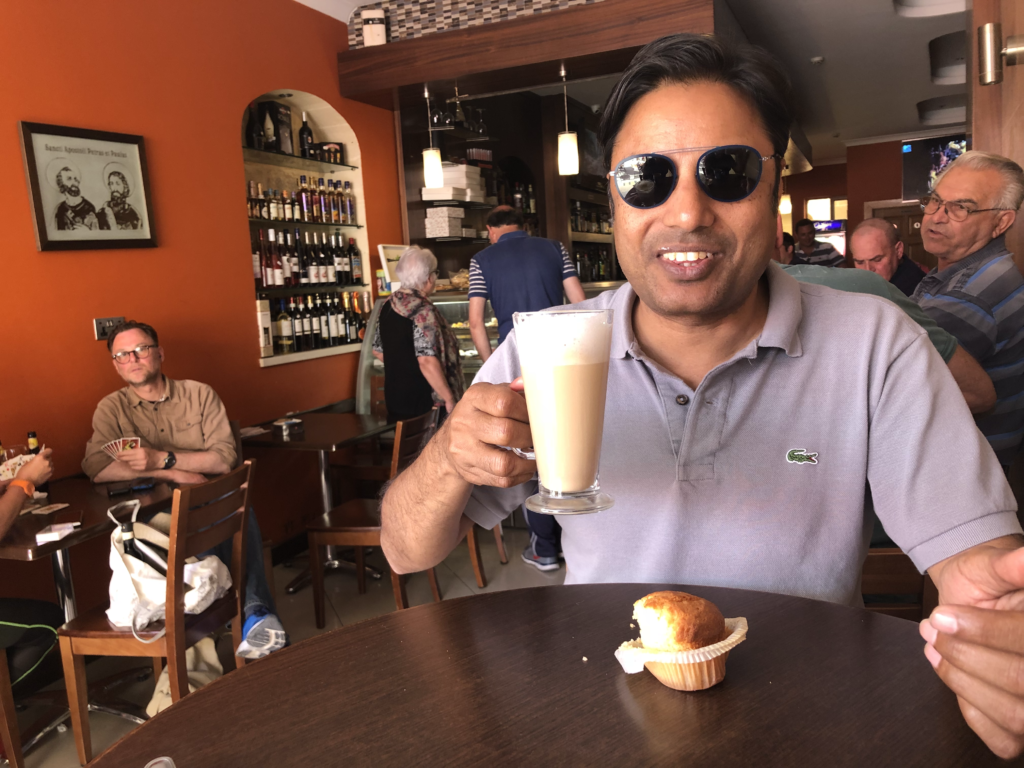 Sipping a delicious cup of coffee in a cafe in Nadur village in Gozo, Malta... with coconut muffins from Merken bakery. 