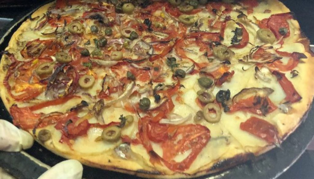 A traditional vegan Maltese Ftira at Mekren's Bakery in Nadur, Gozo