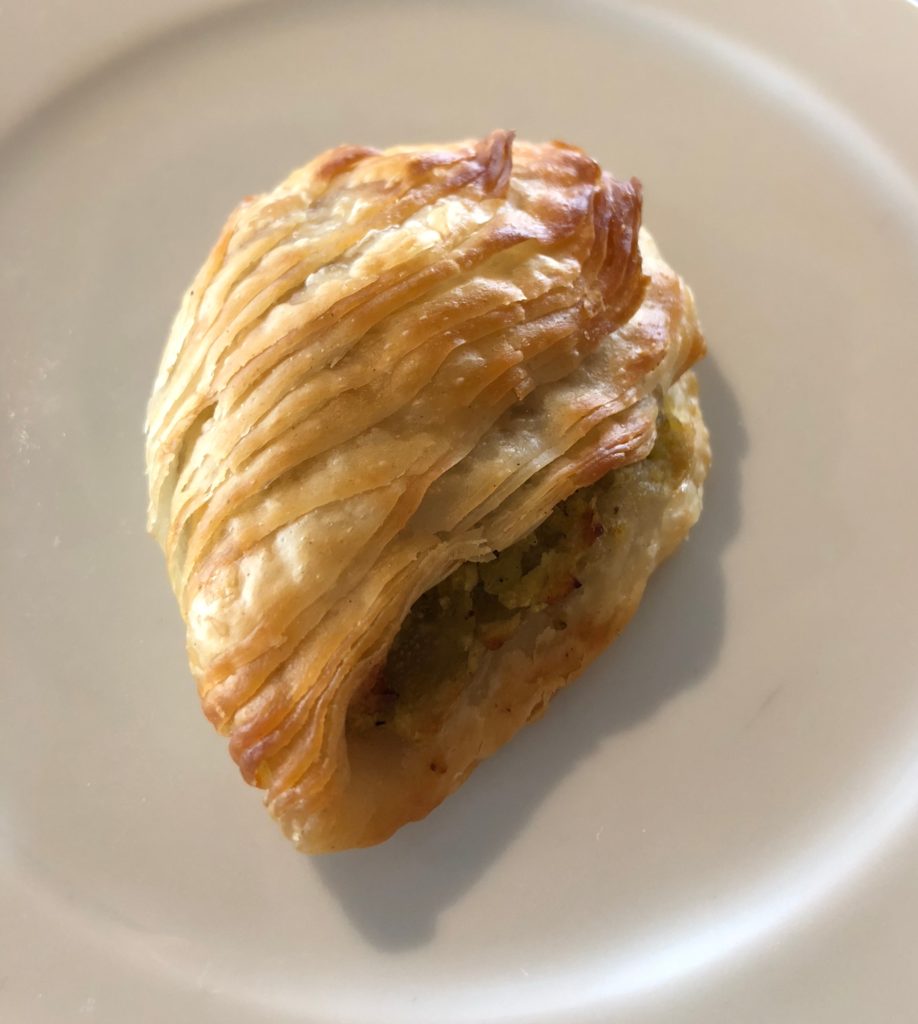 Maltese Pastizz is a traditional savory pastry filled with peas, ricotta or spinach filling.