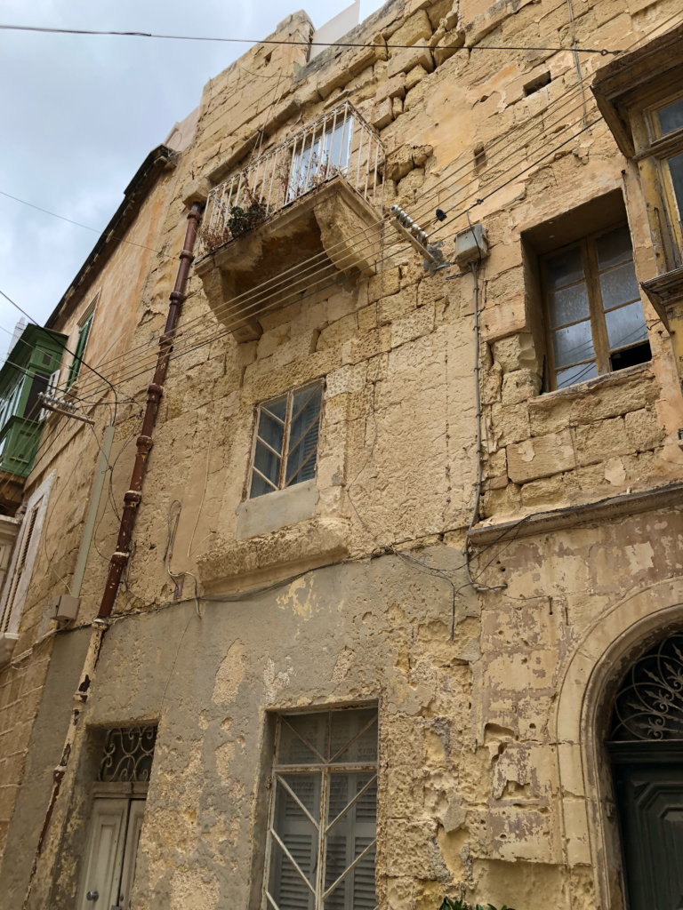 He’s probably right to be concerned for our wellbeing. This Birgu, Malta house does look ancient and fragile. 