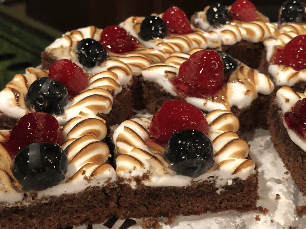 A beautiful cake with delicately torched icing topped with fruit in the Turkish Air lounge in Istanbul.
