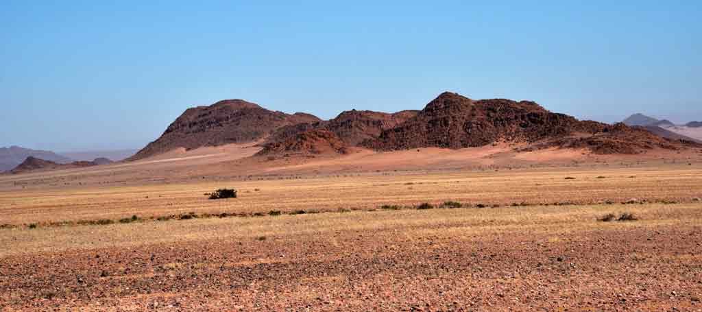 First views of red dunes approaching Namib-Naukluft National Park"
