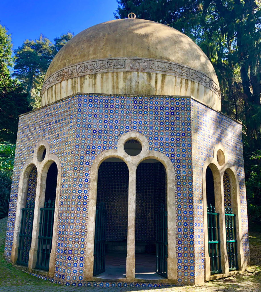 A small rest and drinking hut in Sintra's Pena Palace gardens is covered with tiles.