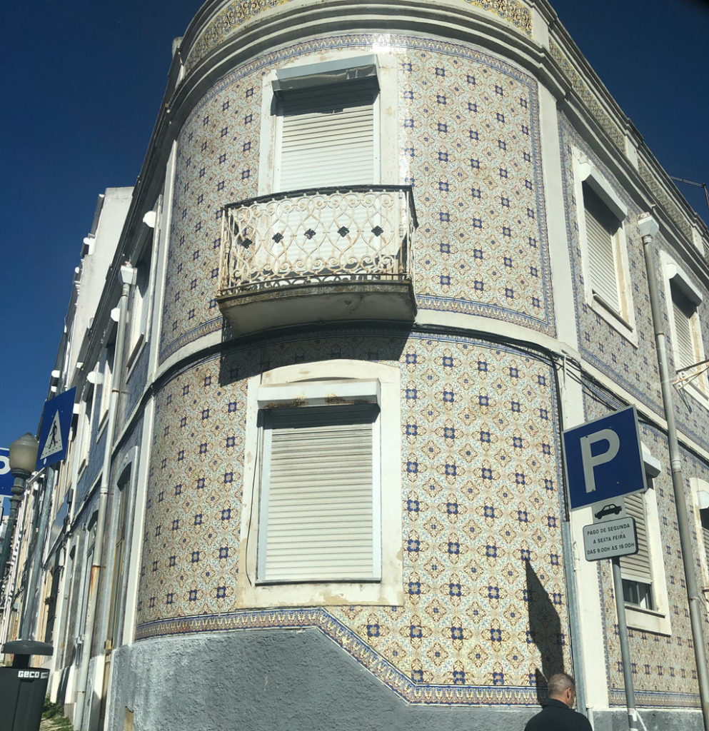 A newer looking building with beautiful tiles design in Lisbon.