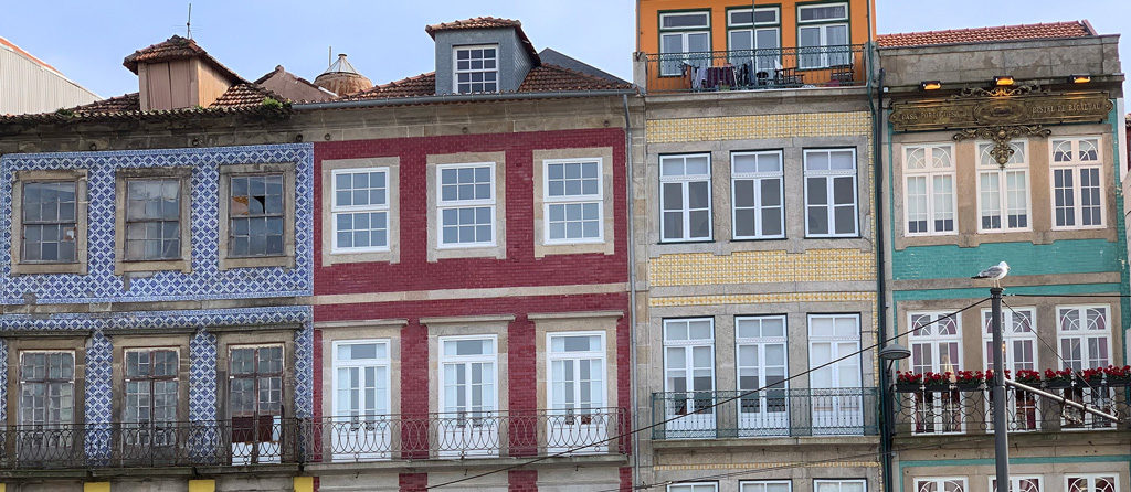 A series of 4 adjacent buildings with entirely different tile designs and styles