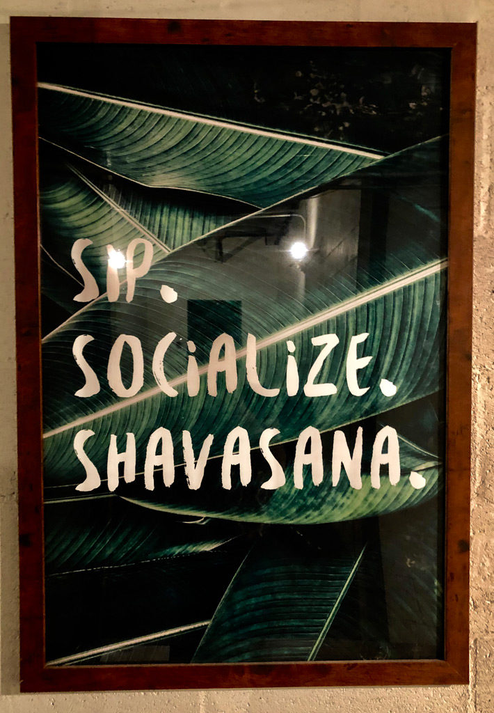 Sip, Socialize, Shavasana  sign in SCP Hotel