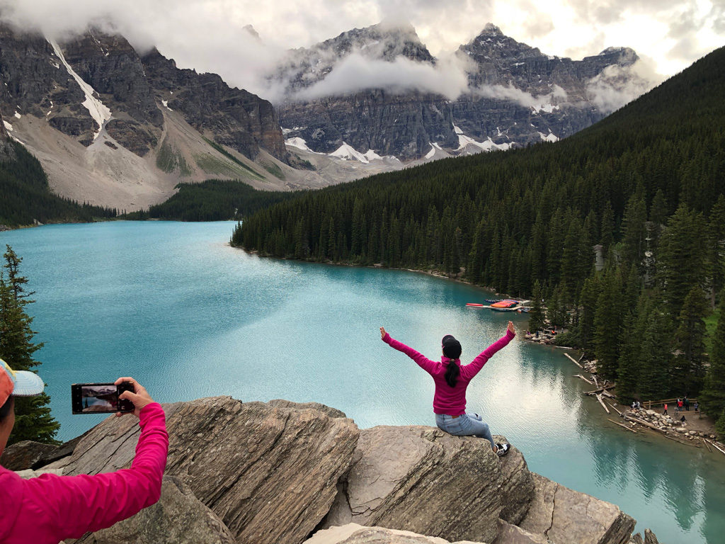 A group of ballet dancers taking pictures at Lake Moraine in the Canadian Rockies. This was our last lake visit in the Canadian Rockies itinerary, so we stayed as much as possible.