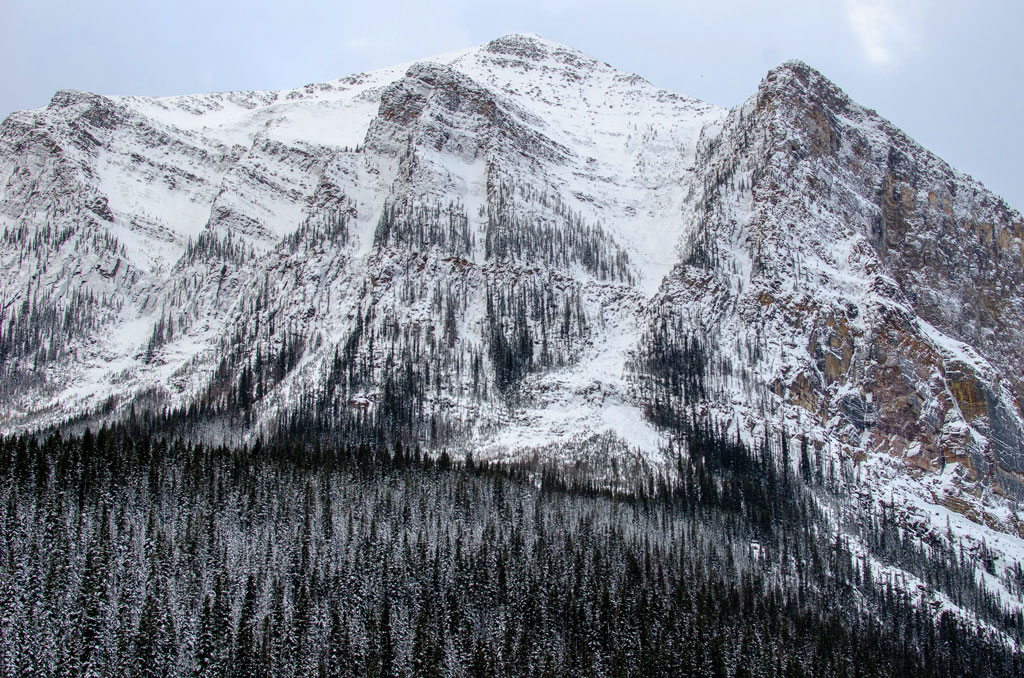 Views of snow covered mountains from the Fairview lookout trail in late fall. In Banff, Alberta, Canada.