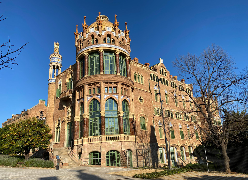 One of the two larger buildings at the other end of the courtyard of hospital Sant Pau in Barcelona.