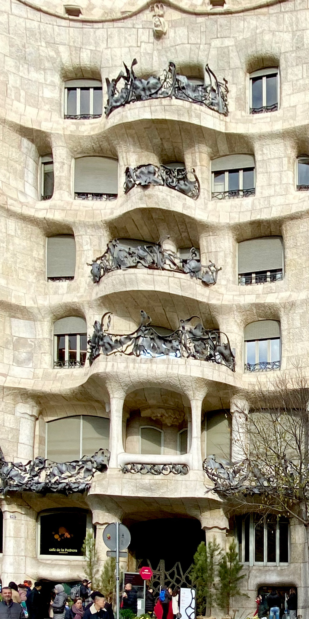 The architecture clearly resembles nature. Check the iron balconies that look like vines in a forest.