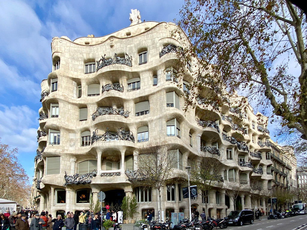 Here is a street view of Casa Míla in Barcelona, Spain. It is clearly inspired by nature and its curves. There are no sharp angles to be seen on the outside or inside of this luxury apartment building. Its this stone facade that inspires the name La Pedrera (stone quarry).