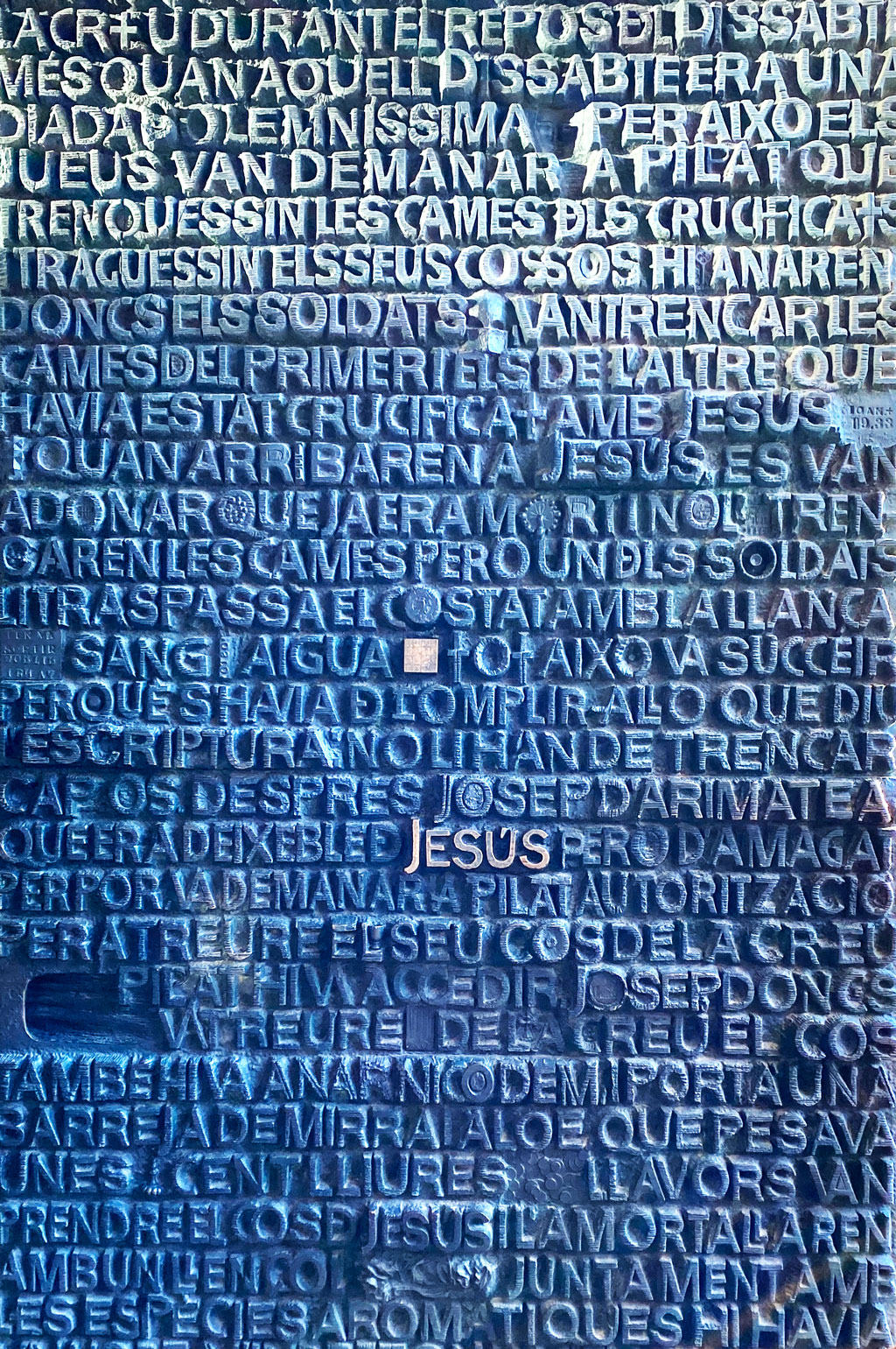 Massive doors exiting towards the Passion facade are filled with words. Which words can you spot?