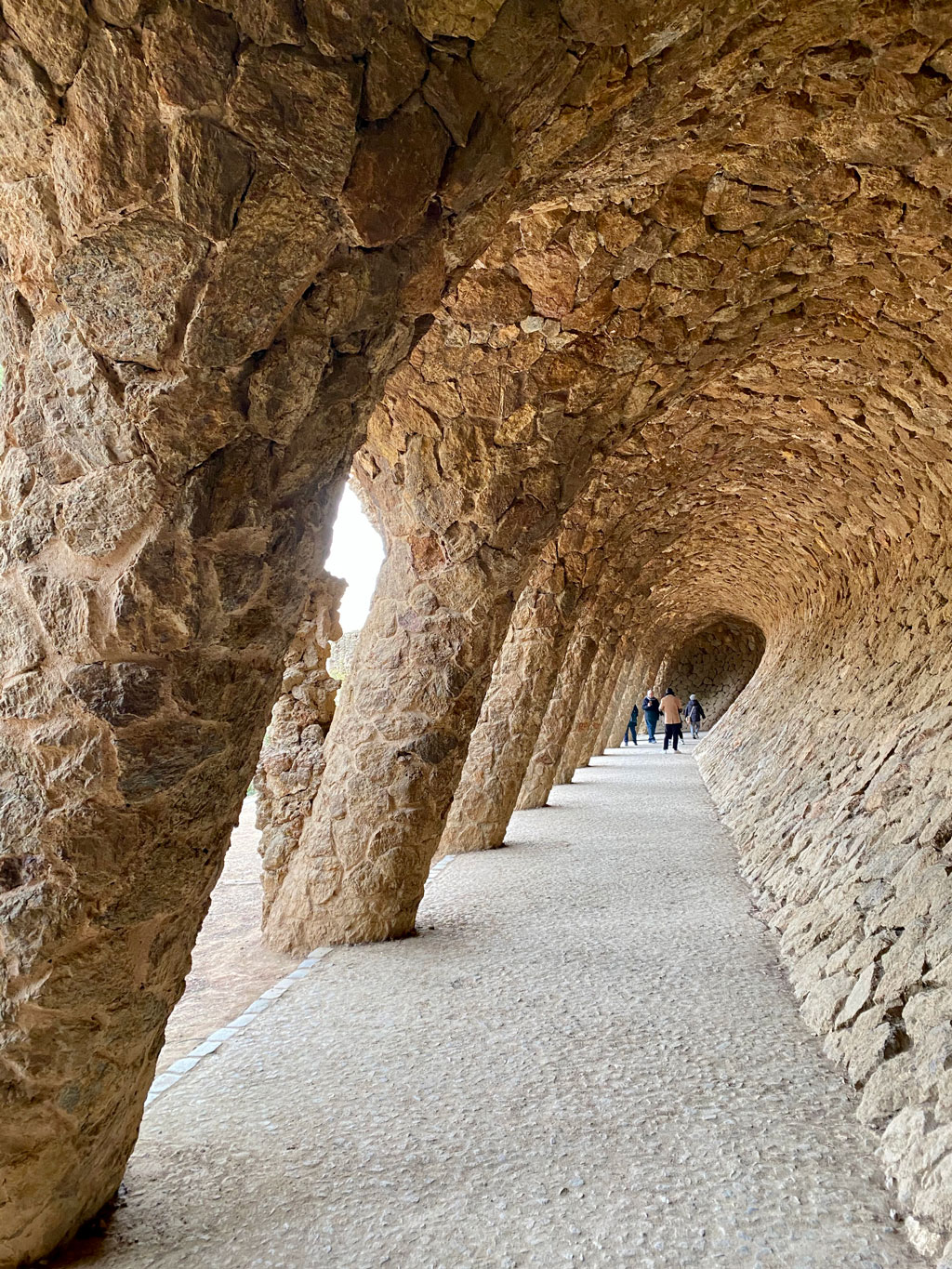 Colonnaded footpath under the roadway viaduct. Sloping columns designed to take diagonal thrust from the vault supporting the road.