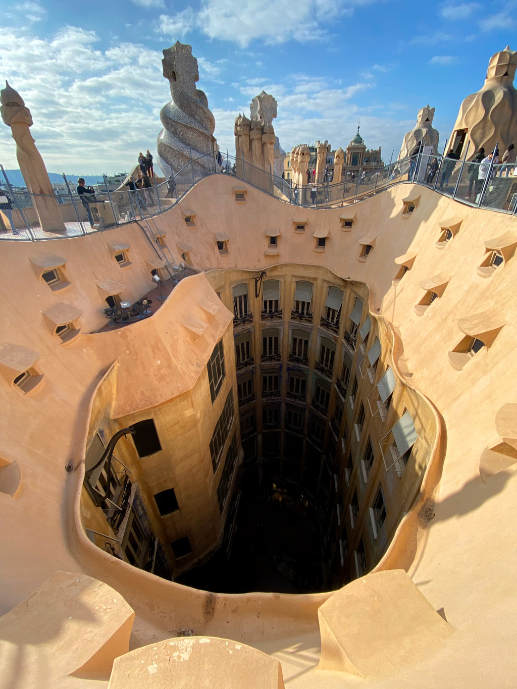 A look down from the rooftop shows the well ventilated Flower courtyard of La Pedrera.