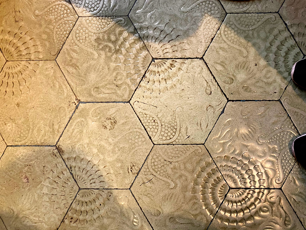 A well used tiled floor in the La Pedrera apartment in Barcelona. Similar tiles are found on the street outside.