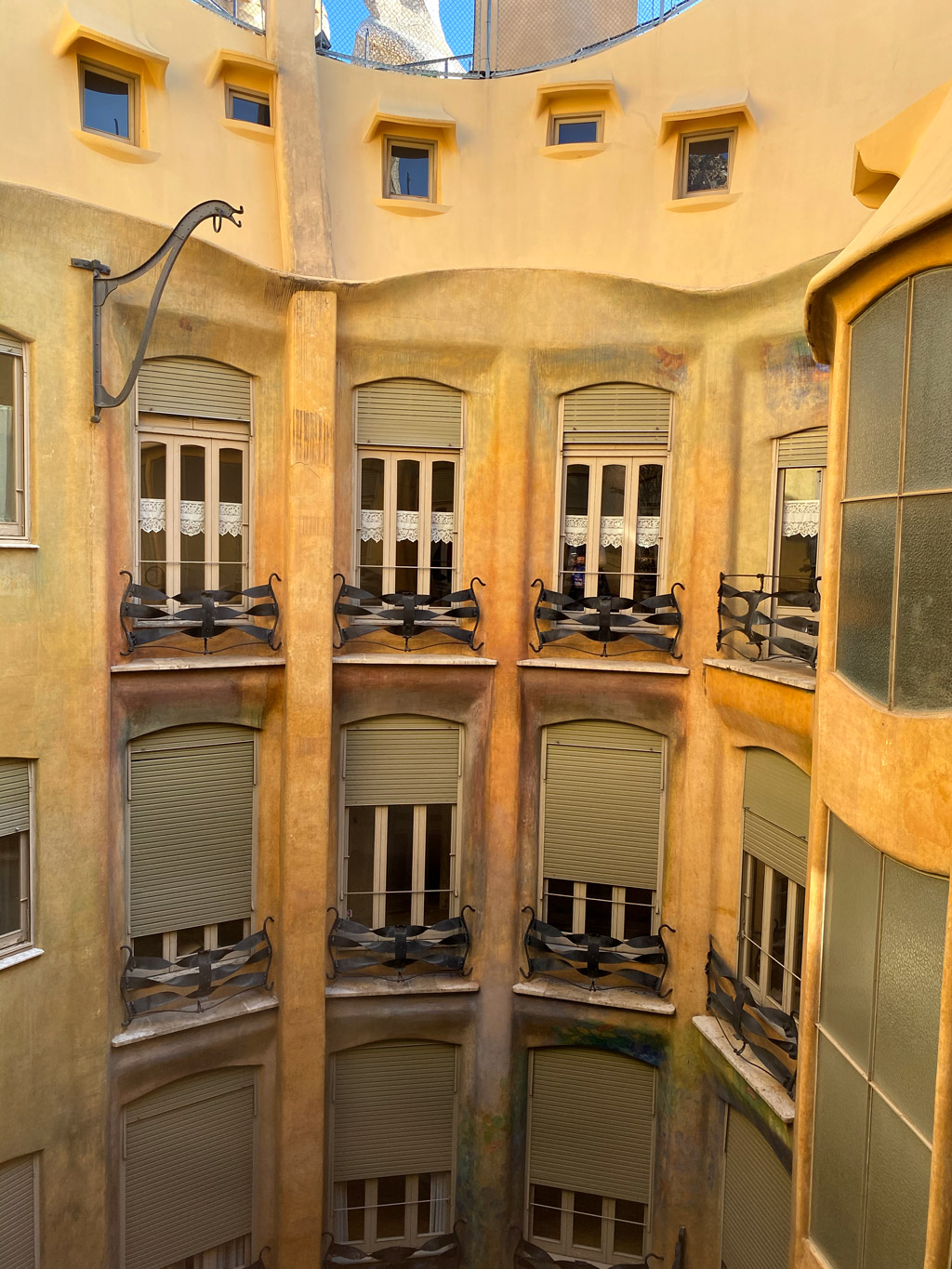 Frosted glass windows on the inside corridor allow for privacy, air and natural light in every part of the La Pedrera apartment (Casa Míla in Barcelona)