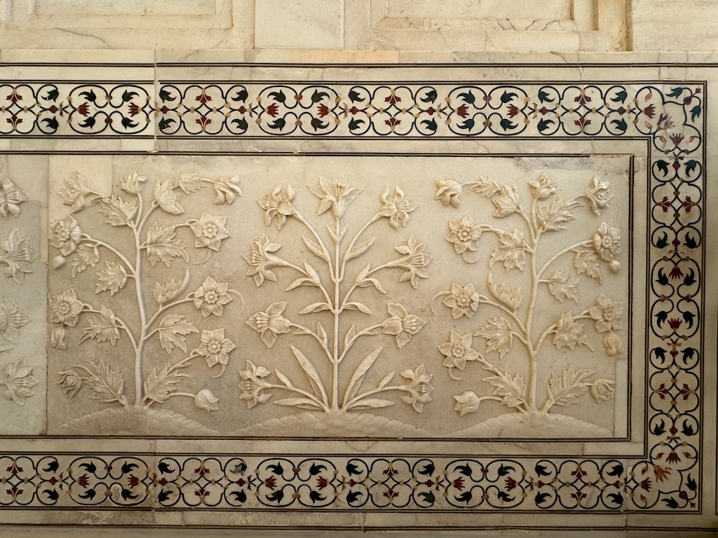 Floral carvings and exquisite inlay work at the Taj Mahal.