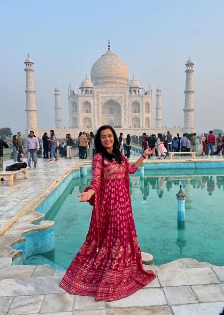 Jyoti with Taj Mahal and the pool