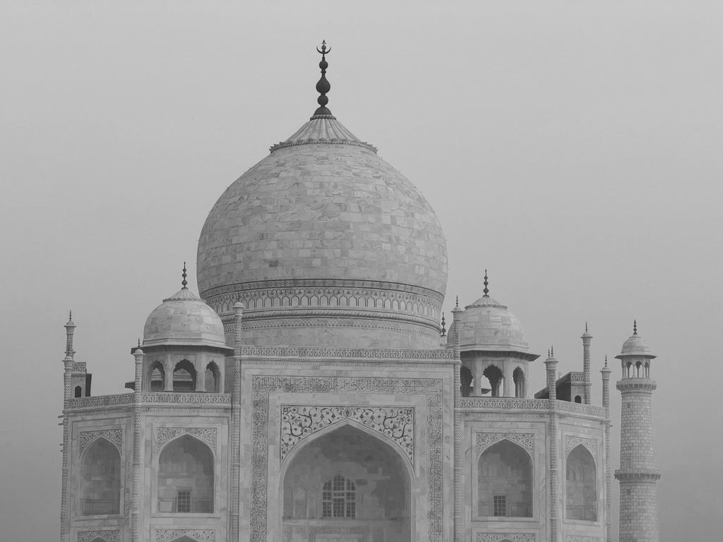 Top section of the Taj Mahal in fog