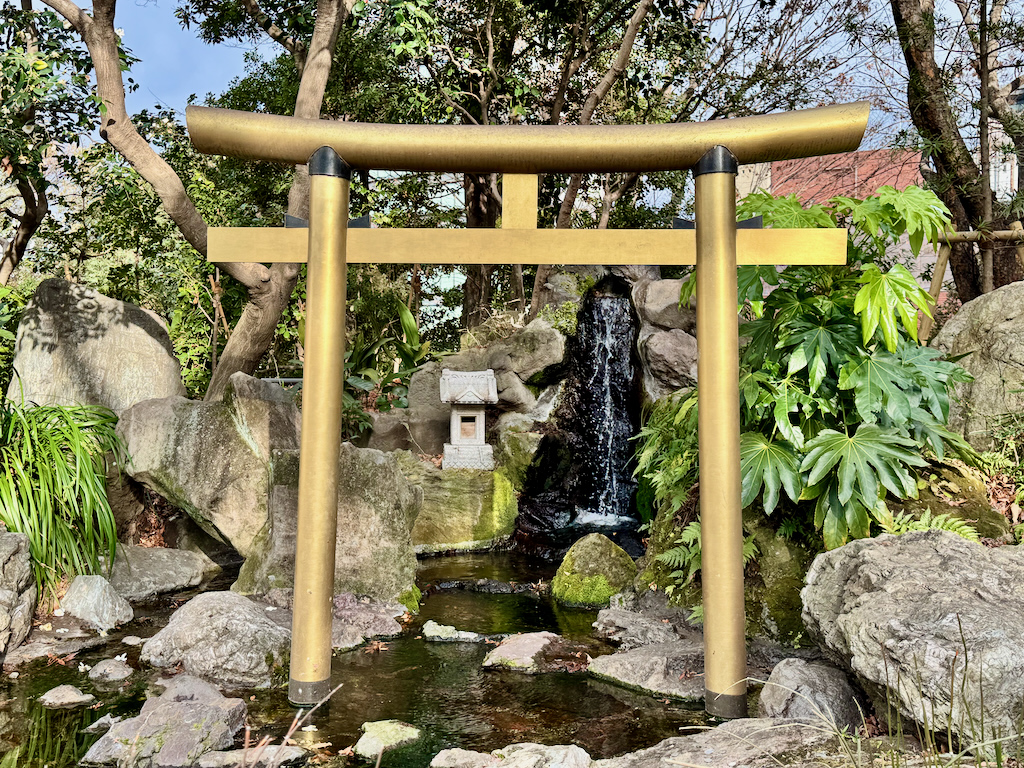 Deity at the waterfall at Atago Jinja in Tokyo