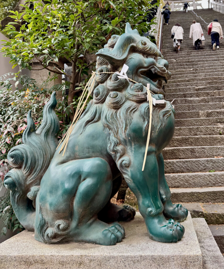 Komainu or Lion-dog statue with the mouth open symbolizing “a” (the beginning of all things). At Atago Jinja in Tokyo